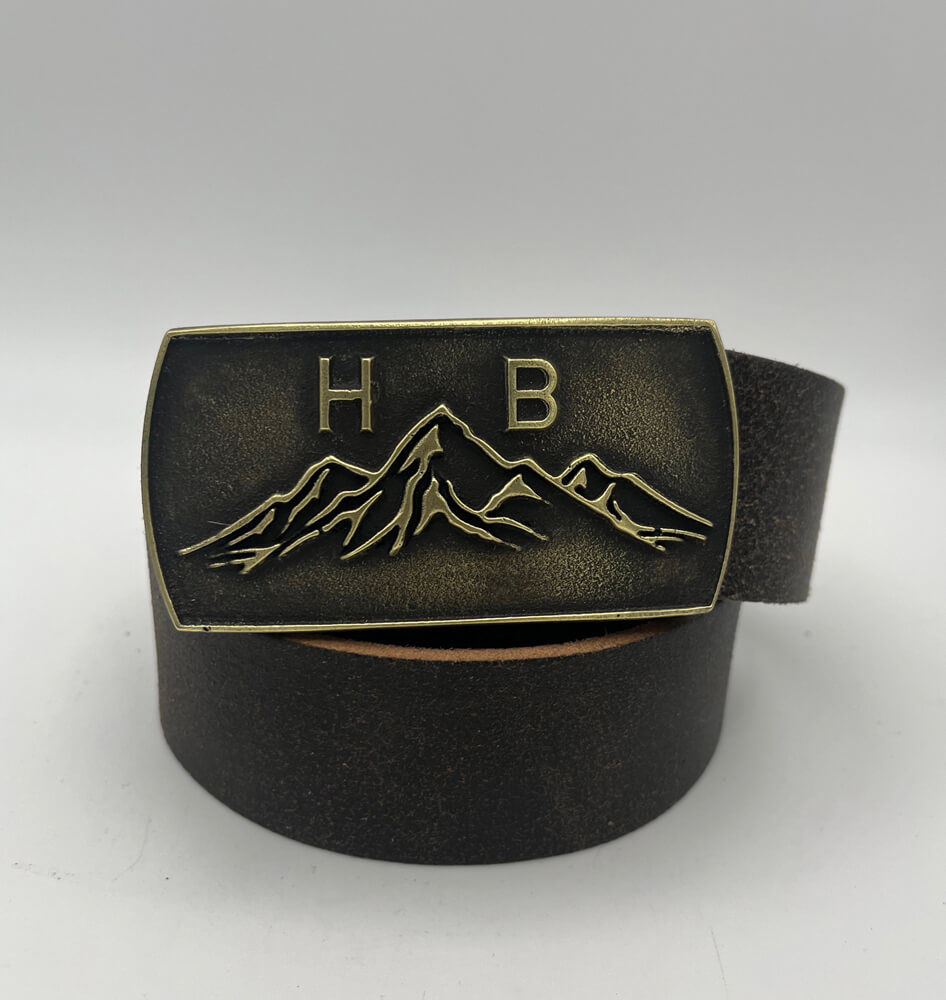 Gürtelschnalle mit Bergmotiv